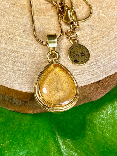 Gold-plated drop pendant with yellow autumn leaf. Color gold - [16mm x 12mm]